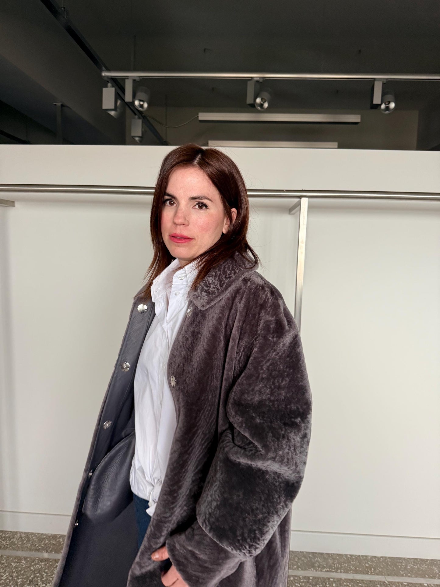 Reversible grayish merino shearling and leather coat: Super warm and silky soft Argento Sheepskin stroller.