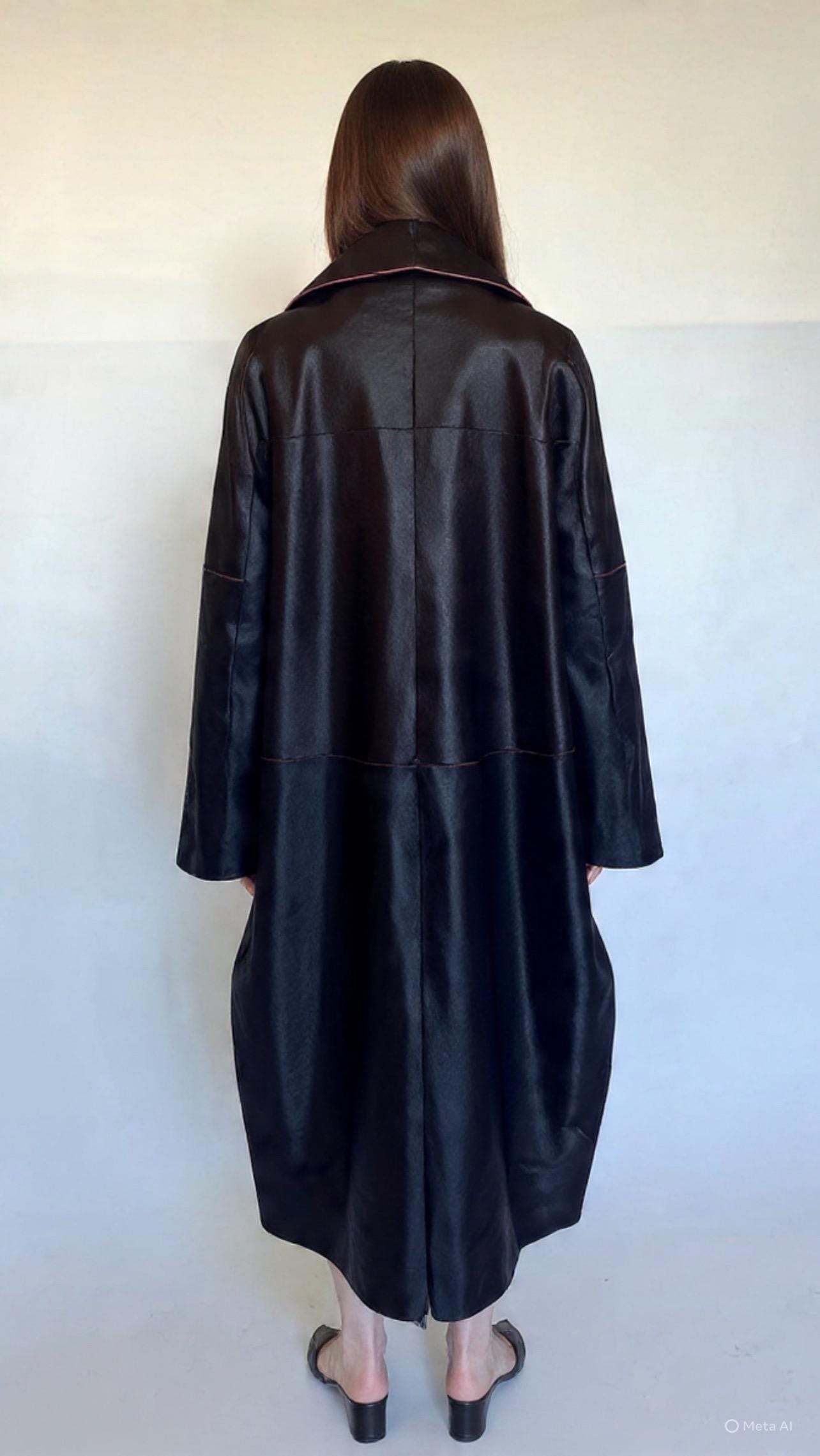 Burgundy Hair-On Leather Coat: Oversized Handmade Cavallino Calf full length with slits on the sides.